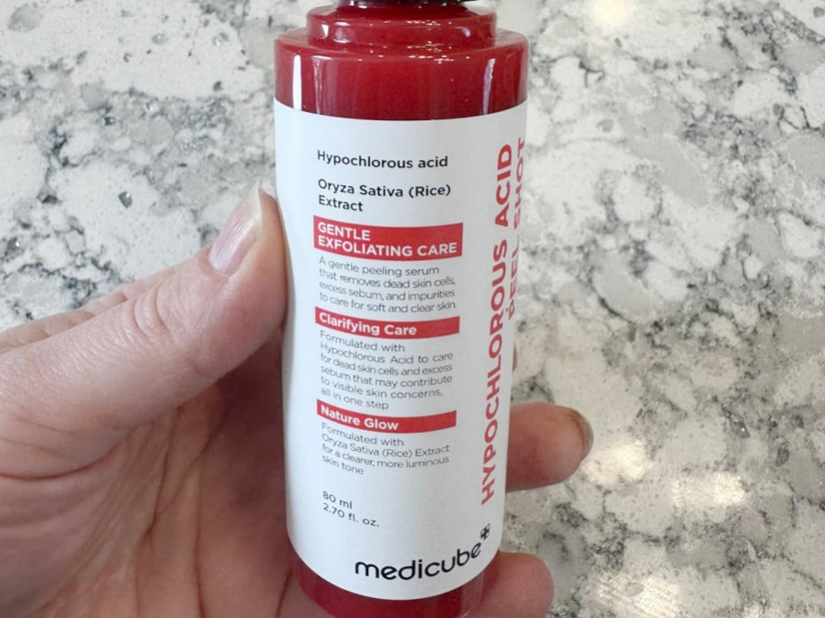 hand holding medicube acid shot