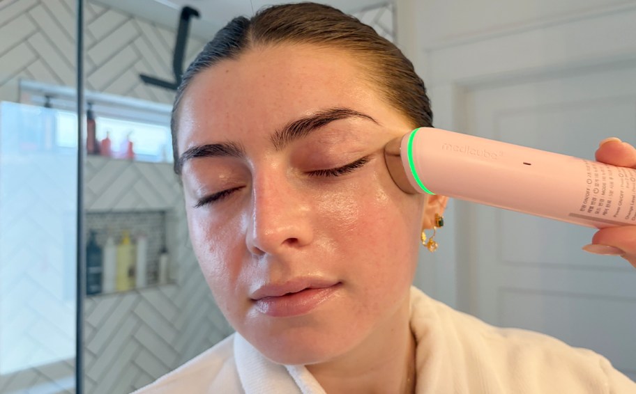 girl using medicube massager