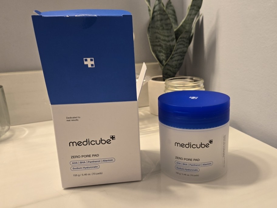 medicube toner pads box and jar on a bathroom counter