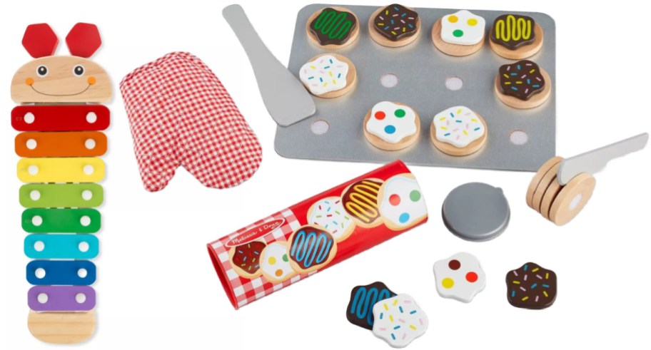 Wooden toys including a caterpillar xylophone in rainbow colors, a red-checkered oven mitt, a baking tray with cookies, and a spatula set.