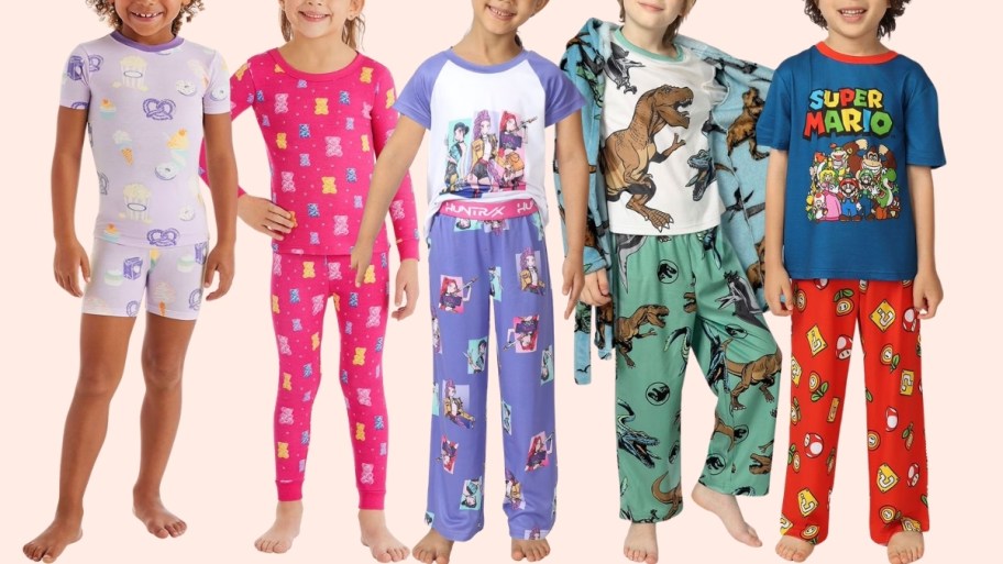 five kids wearing character pajama sets