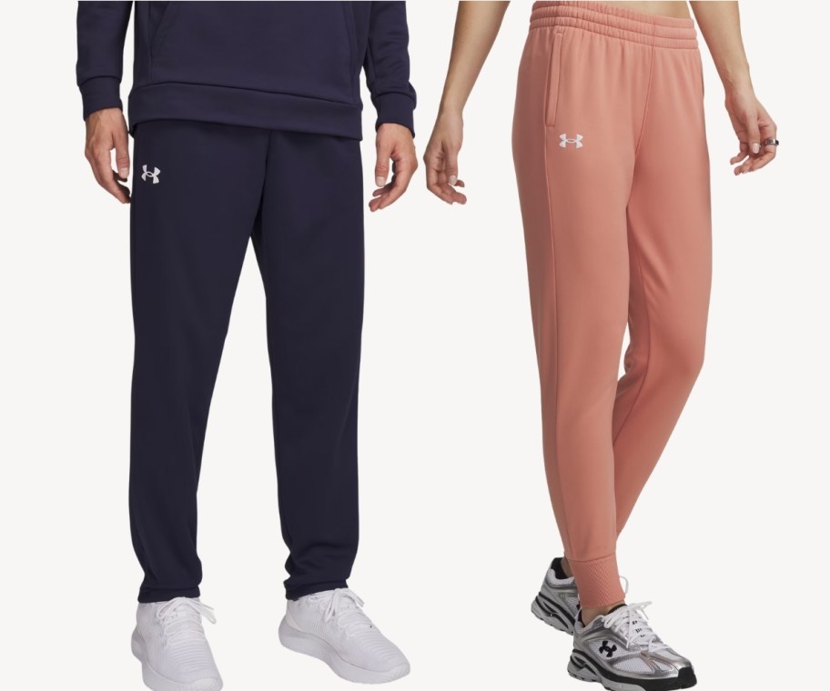 man wearing navy joggers with woman wearing pink joggers