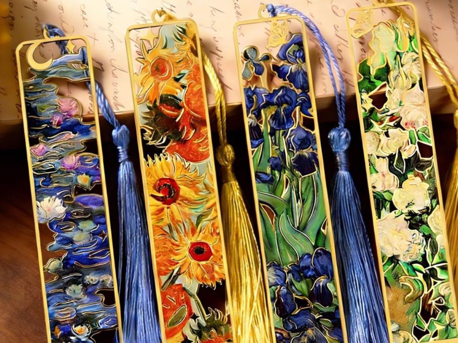 Four metal bookmarks on display