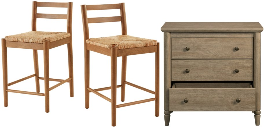 Two wooden bar stools with woven seats are next to a gray wooden nightstand. The nightstand has two drawers, one slightly open.