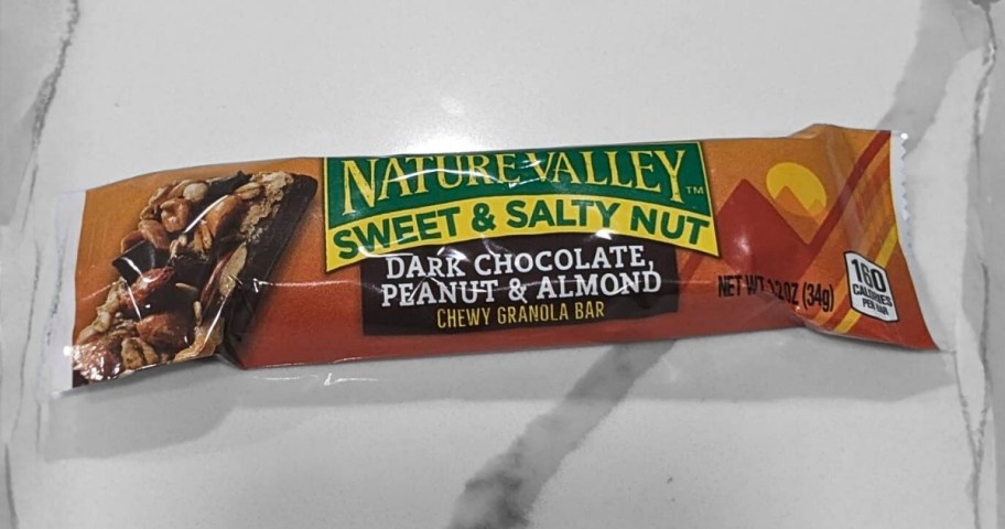 a granola bar in a wrapper on a countertop