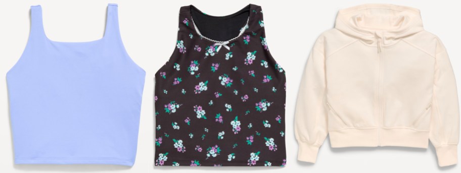 Purple and black sports bra and white hoodie.