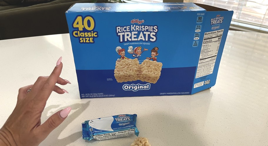 hand pointing to box of 40 count Rice Krispie treats