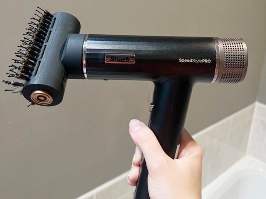 hand holding black sharkstyle pro 