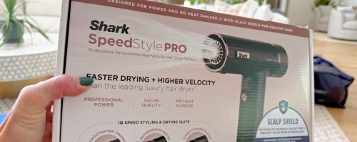 hand holding a box with a shark speedstyle pro inside