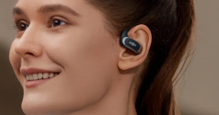 woman wearing a pair of SHOKZ earbuds
