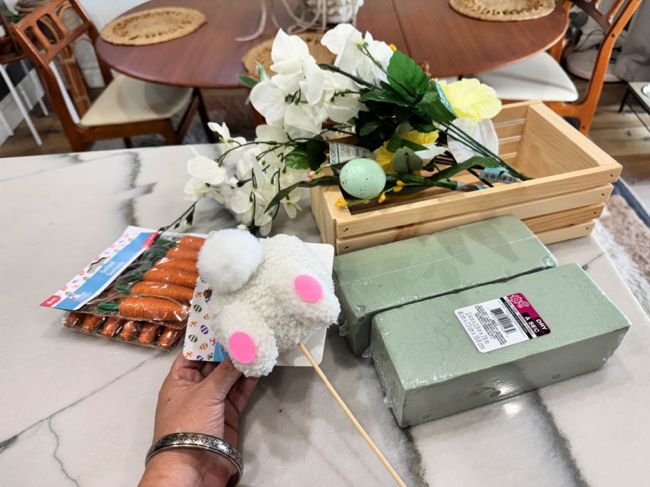 supplies to make a bunny centerpiece from dollar tree on the counter