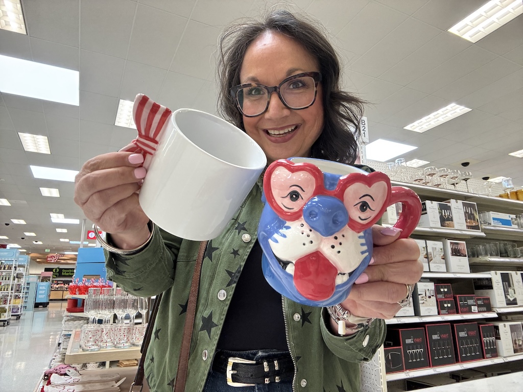 Lina holding Target Valentine day coffee mugs 