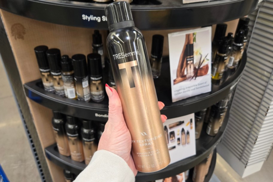 hand holding texturizing hair spray in store
