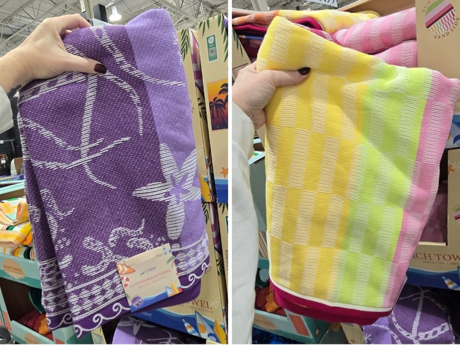 womans hand holding up 2 beach towels in different prints