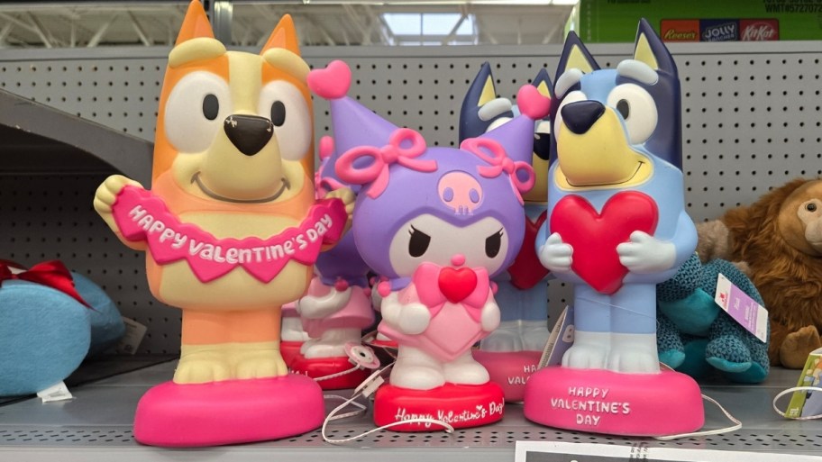 bingo, kuromi and bluey blow molds on a store shelf