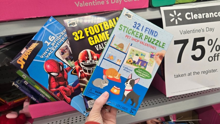 womans hand hold 3 pack of valentines