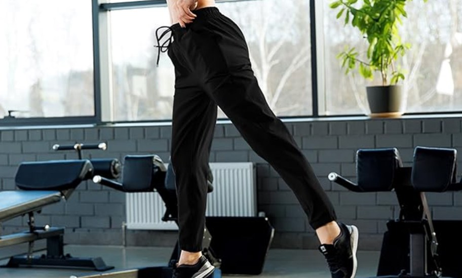person wearing black joggers
