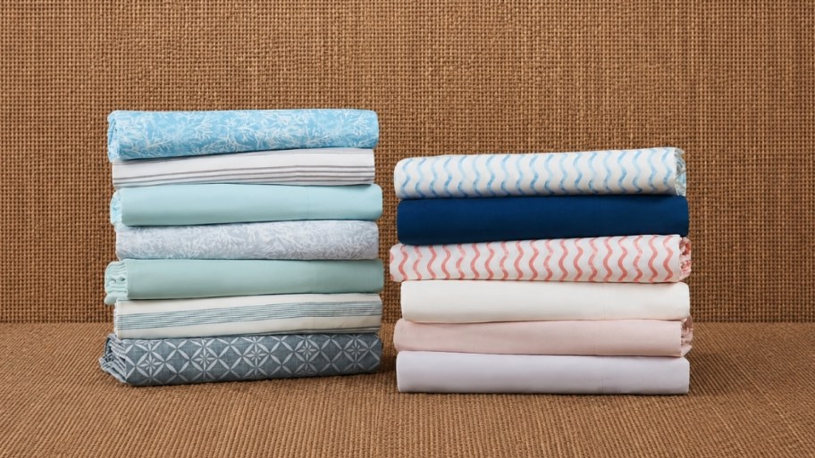 2 stacks of folded printed sheets
