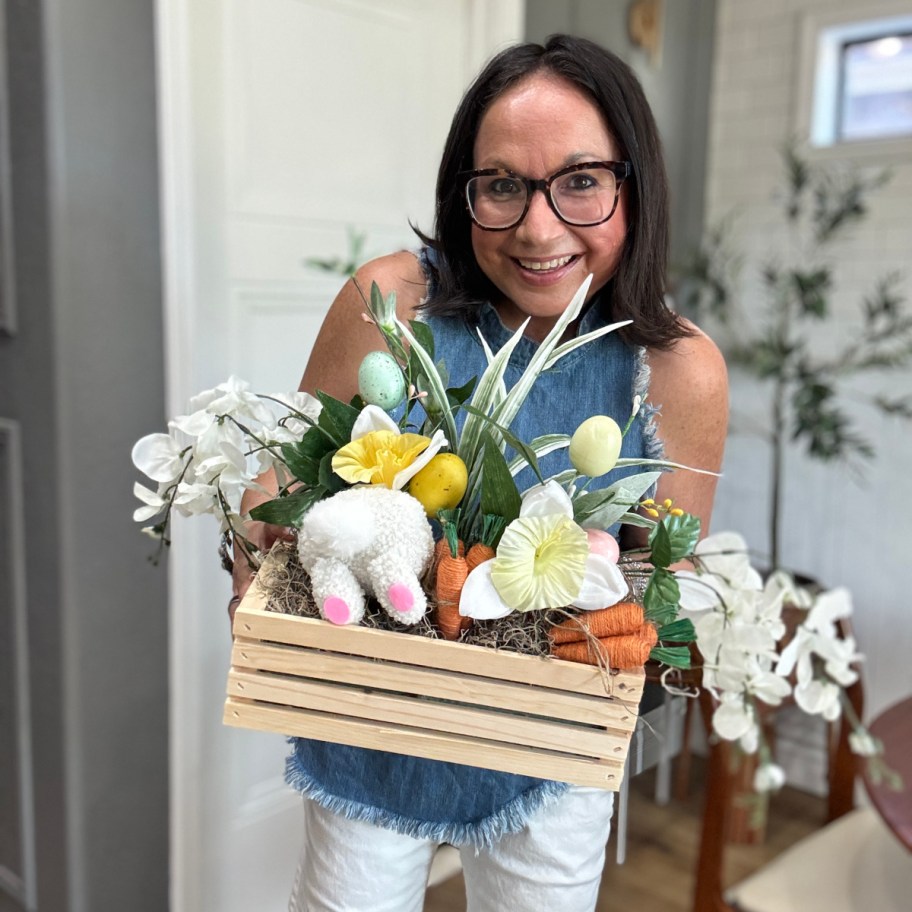 woman holding an easter bunny butt centerpiece 