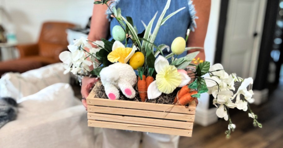 woman holding an easter centerpiece