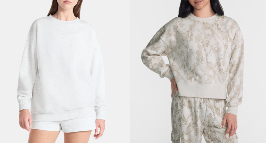 2 women wearing white sweatshirts