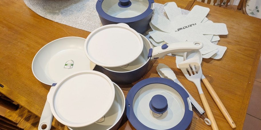 blue and white pots and pans set on table