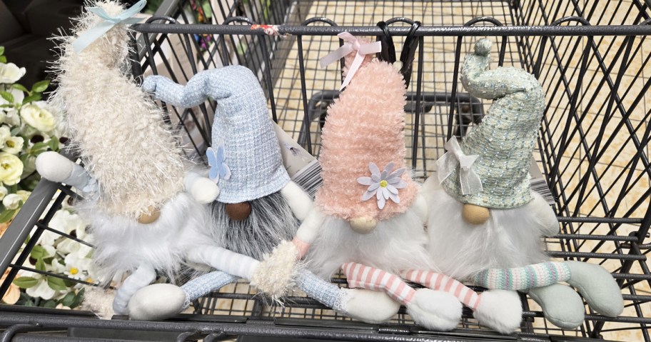 mini gnomes in a row in a shopping cart