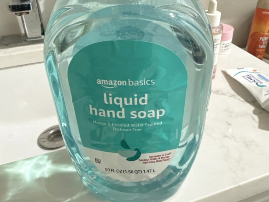 large blue bottle of hand soap on bathroom counter