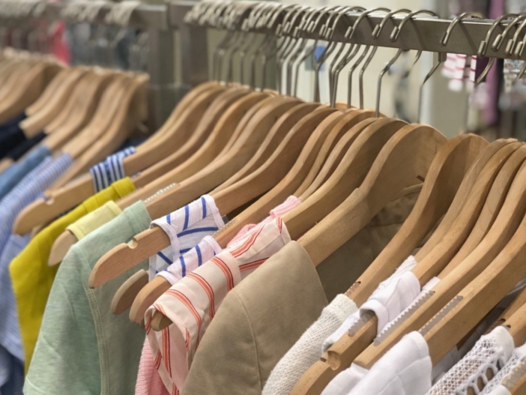 Women's clothing hanging on hangers in store