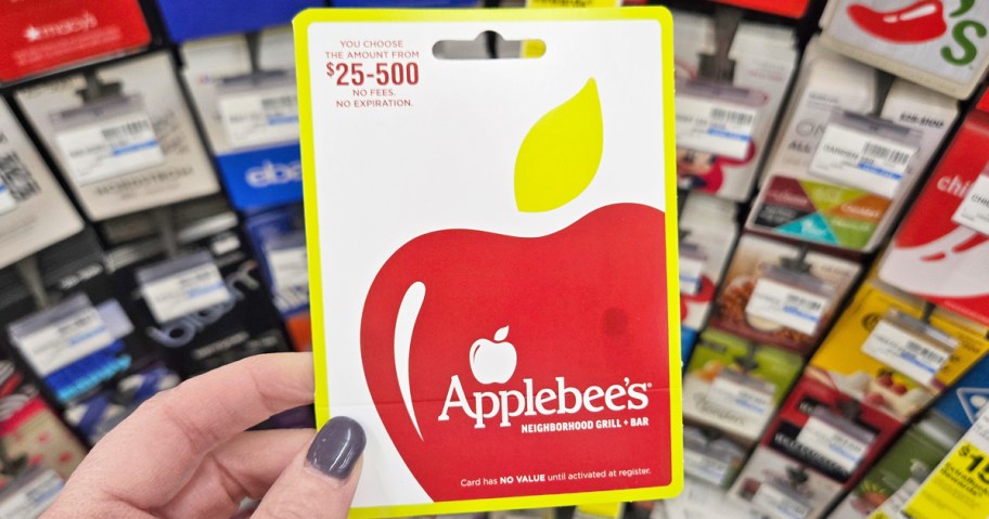 hand holding an Applebee's Gift Card in store