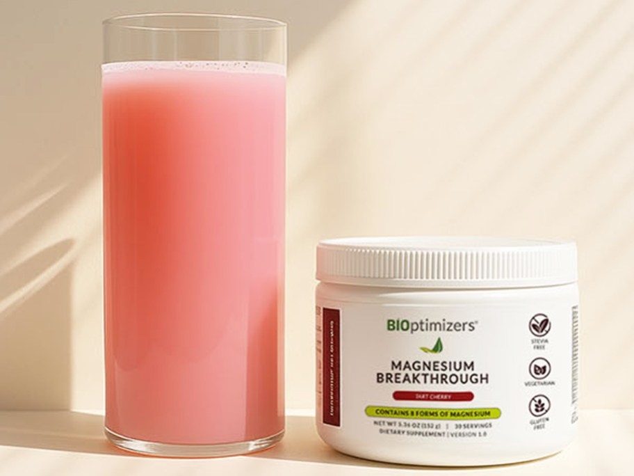 pink drink near a container of BIOptimizers Magnesium Breakthrough Drink Powder
