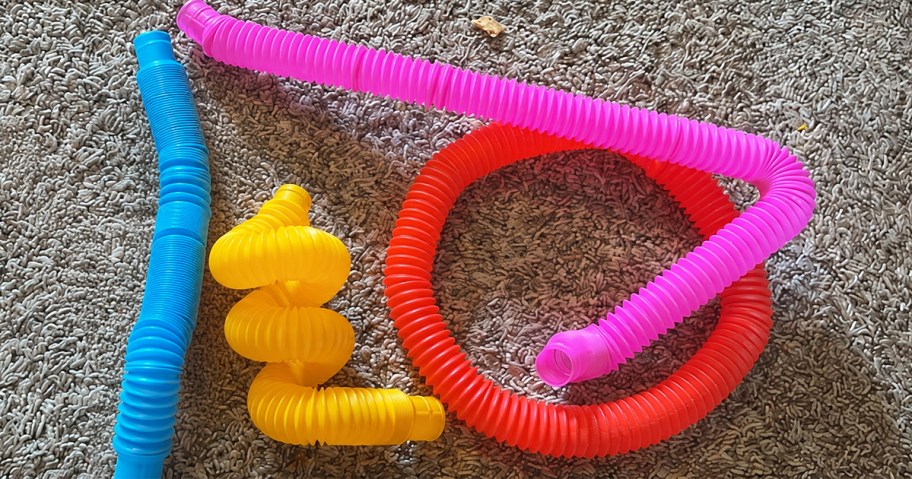 4 colorful sensory tubes on carpet