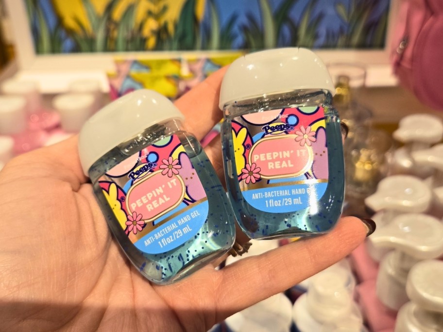 Person holding a bottle of Peeps Pocketbac hand sanitizer at Bath & Body Works