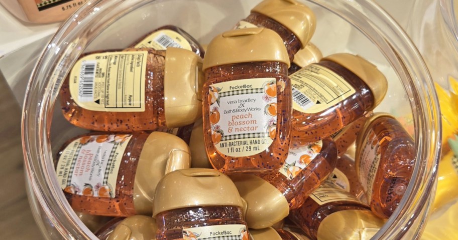 glass jar full of mini hand sanitizer bottles