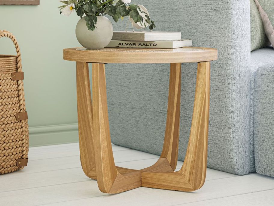 Beautiful Rattan & Glass Side Table next to couch
