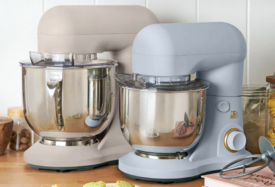 small and large stand mixers on a counter