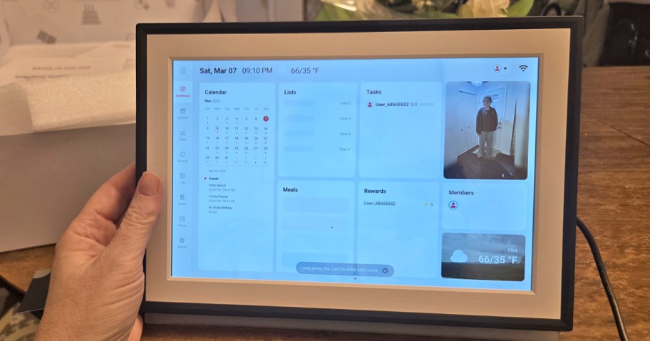 hand holding up a digital calendar