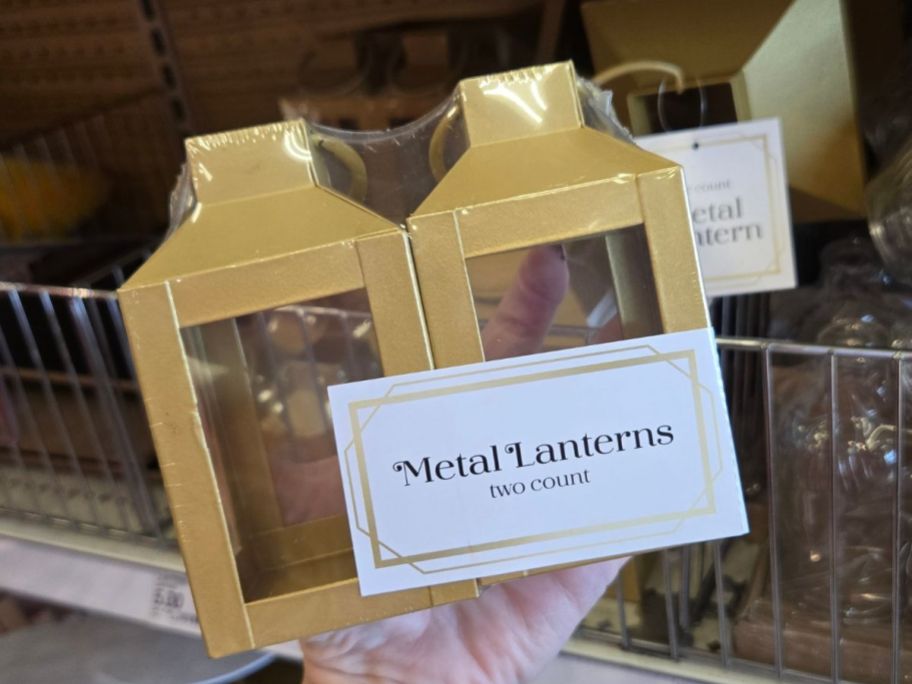 Hand holding a 2-pack of Small Metal Lanterns