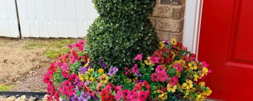 bunny topiary in planter with artificial flowers