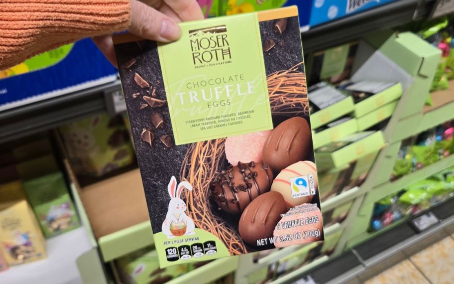 Hand holding a box of Chcoolate truffle eggs