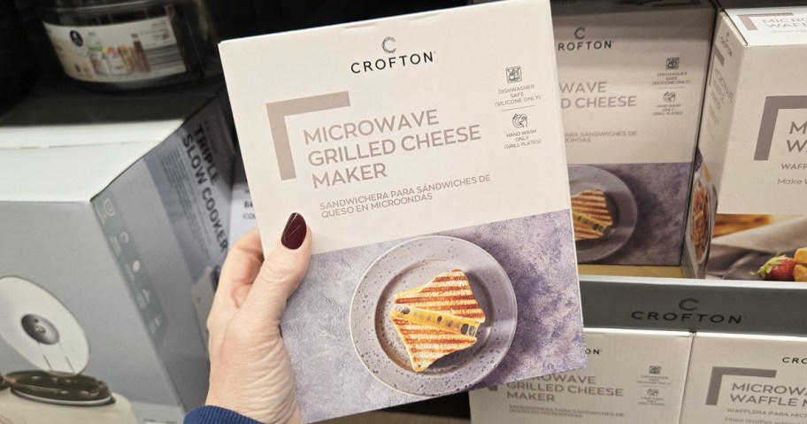 hand holding up box to a Microwave Grilled Cheese Maker in store