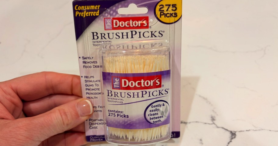 hand holding up Doctors Brush Picks