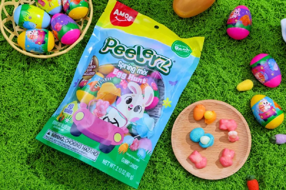 Easter Peelerz gummies bag next to Easter eggs and gummy candy