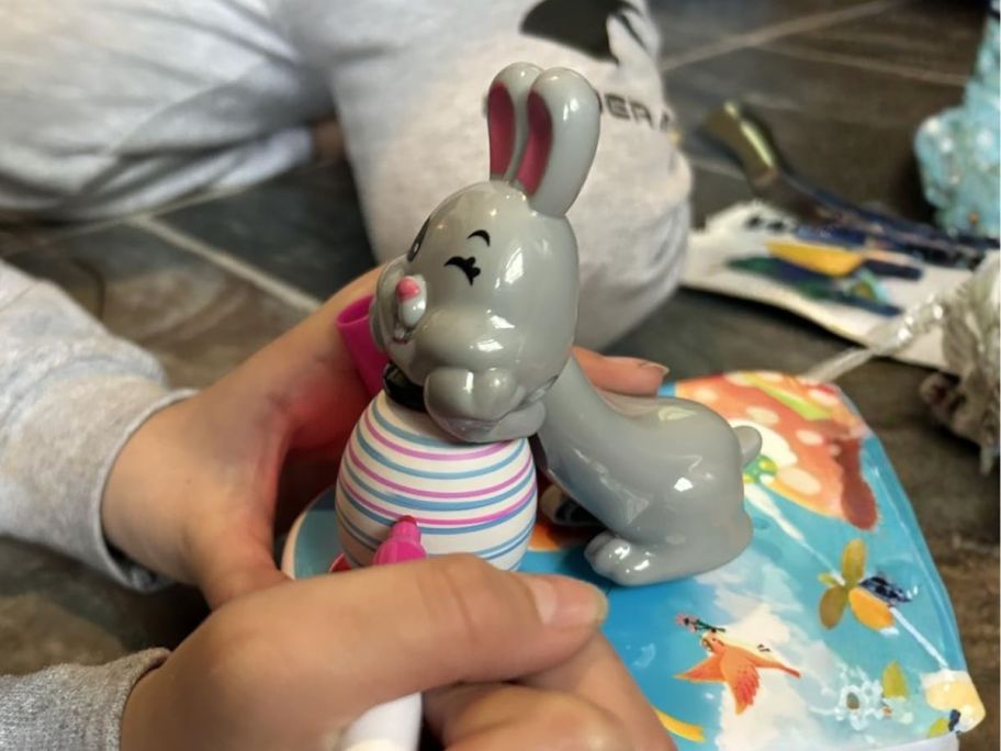 kid using egg decorating kit