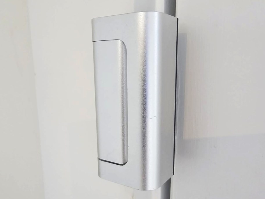 silver door lock installed on a door frame