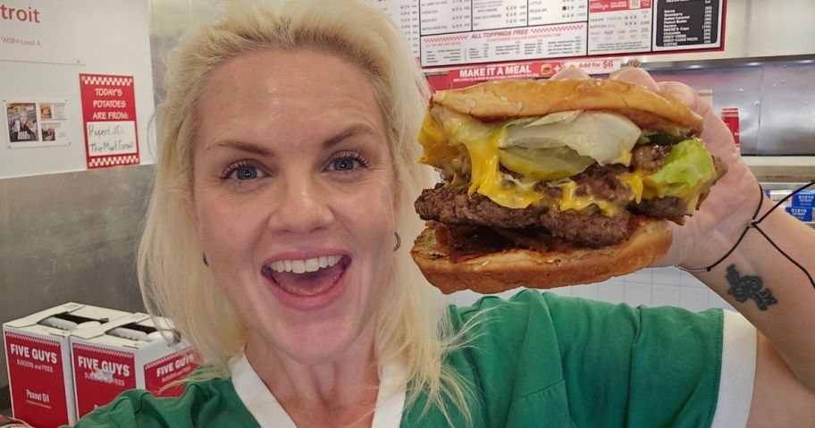 Woman holding a Five Guys Cheeseburger