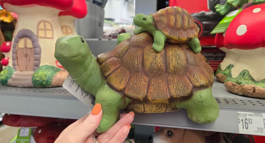 woman holding Garden statues turtle at the store