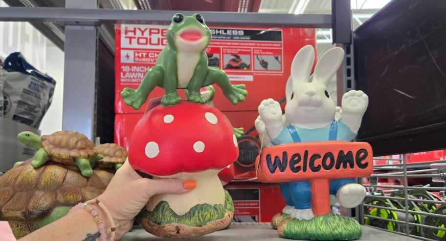 hand holding mushroom garden statue