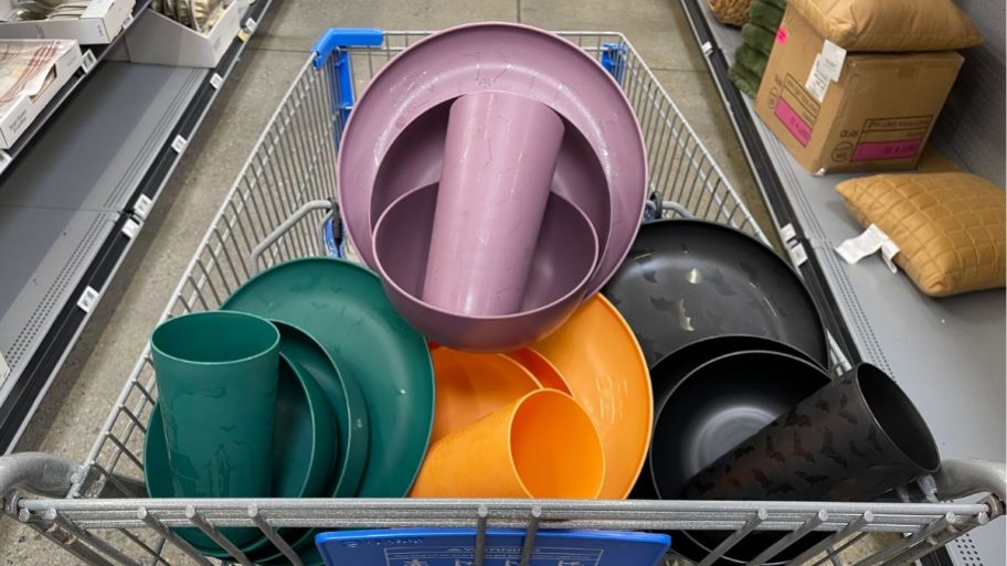 Halloween and fall plastic plates sets inside of a Walmart shopping cart