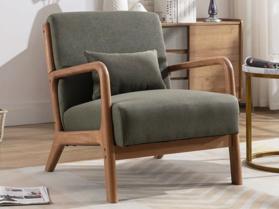 dark green accent chair with wood arms and legs